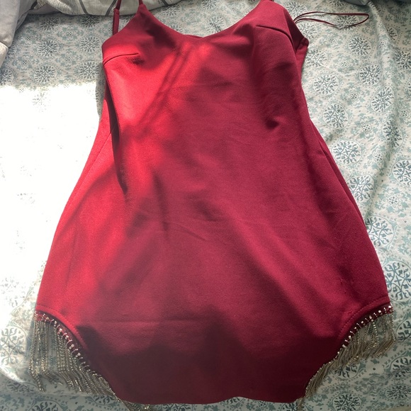 Wine red tight dress . Charms dangling from the sides to give it a sexy look . - Picture 1 of 2